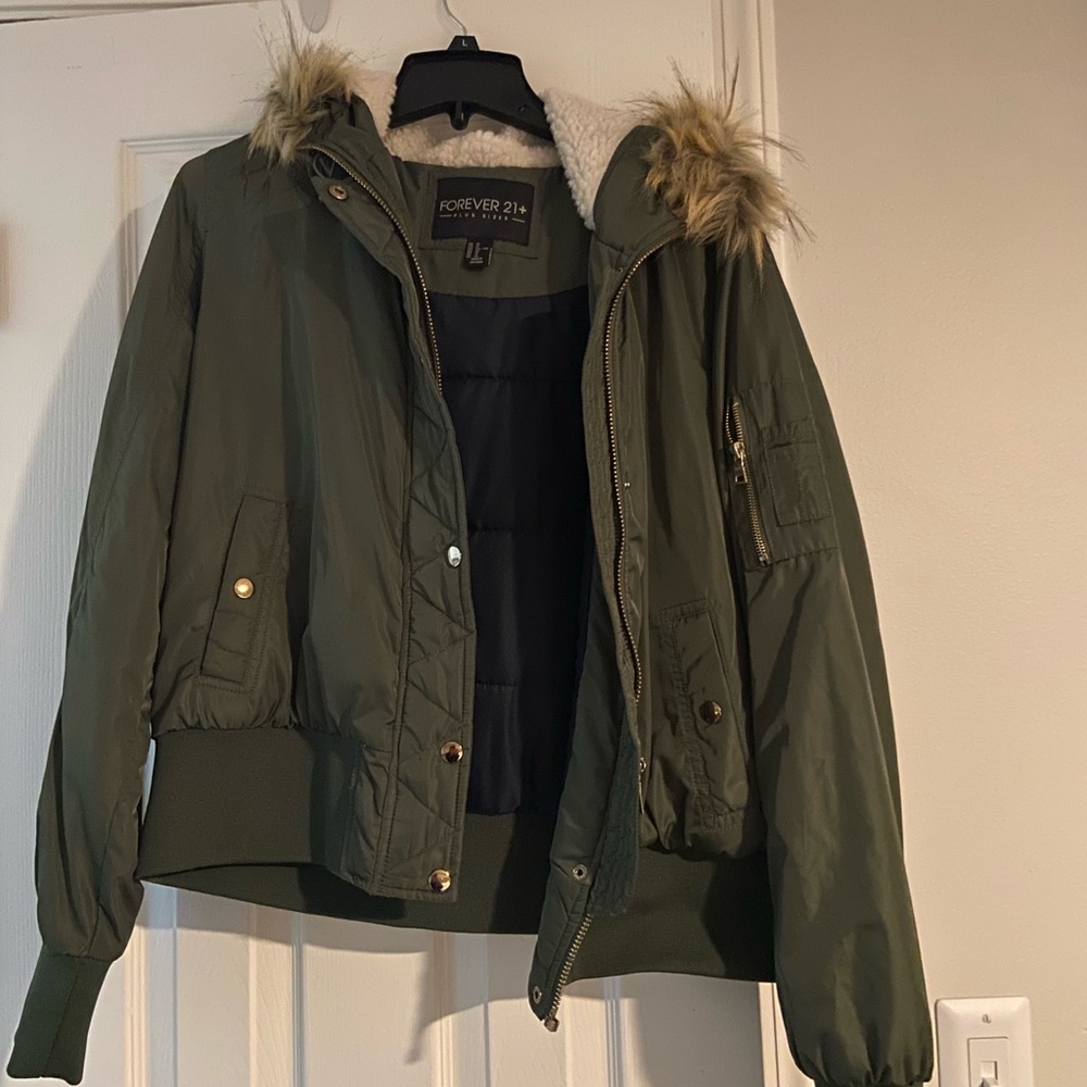 Green Jacket with fur hood.